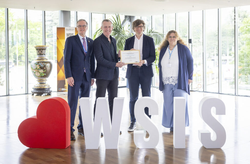 Andrew receiving the WSIS award at the United Nations