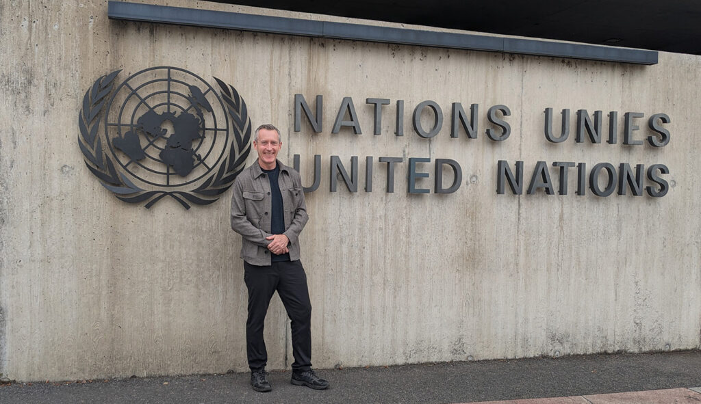 Andrew from Stitch outside the United Nations championing senior friendships